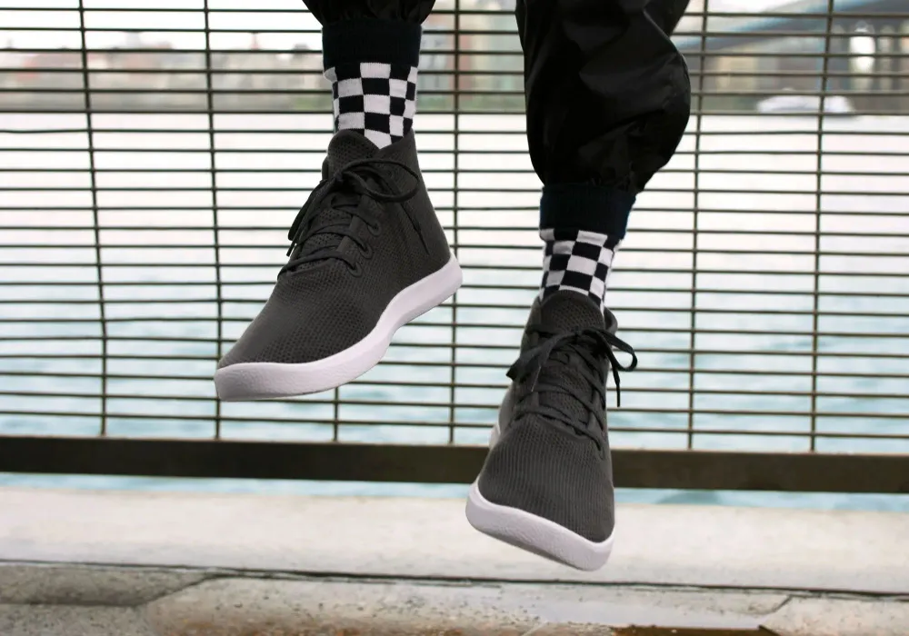 a pair of allbirds high top sneakers